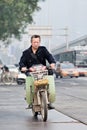 Man on e-bike in city center, Beijing, China Royalty Free Stock Photo